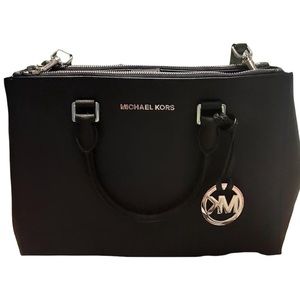 michael kors black purse with silver accents never used, still has paper inside